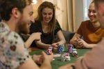 Friends playing poker at home