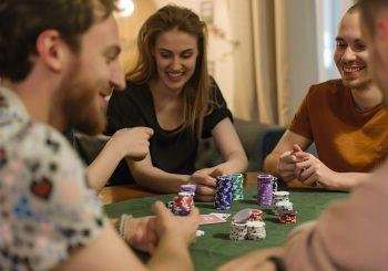 Friends playing poker at home