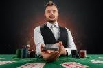 Photo of Belgian Dealer ready to deal your next hand at an online casino
