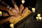 The Ouija Board with people playing it