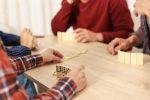 Friends playing dominoes