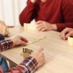 Friends playing dominoes